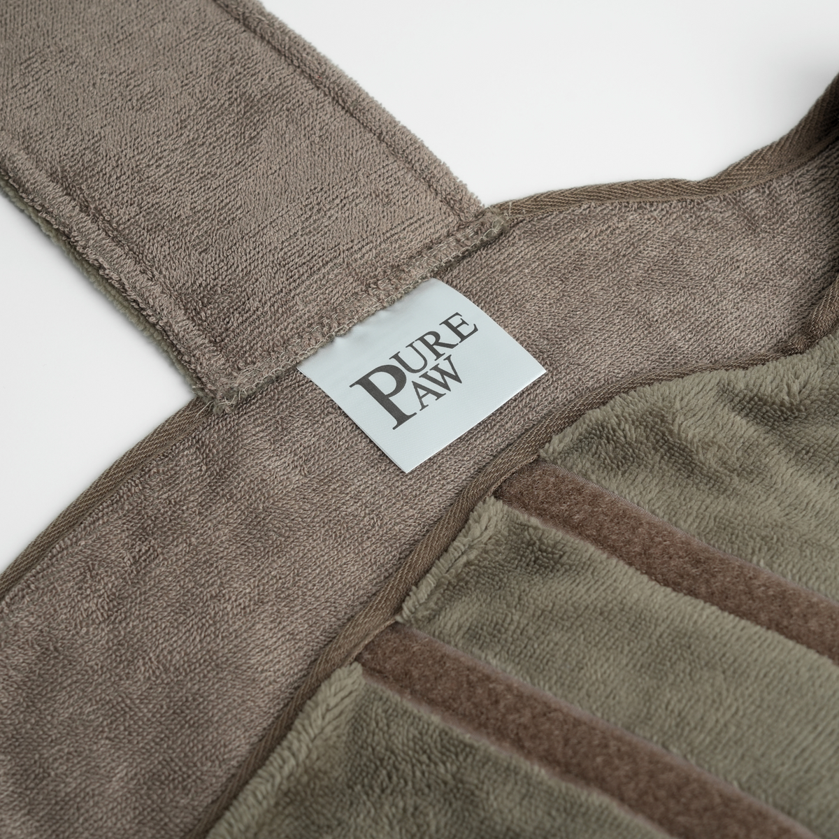 Close-up of the PurePaw label on a bamboo drying robe
